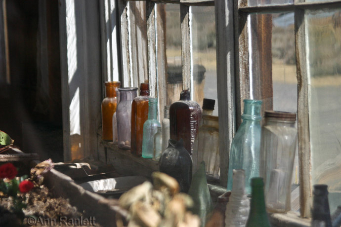 Another View of the Bottles in a Window